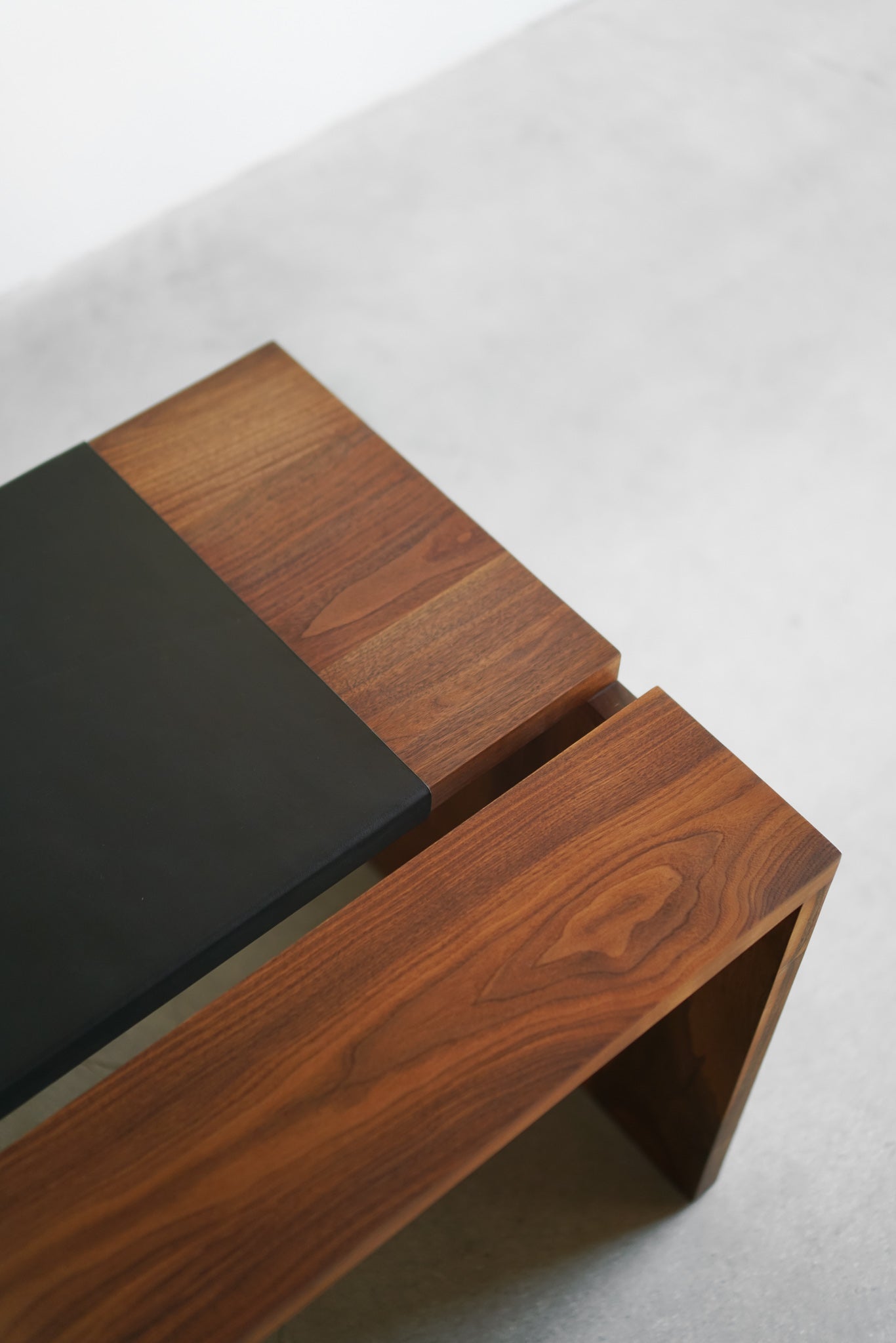 Carter desk - close shot of walnut wood and leather detail 