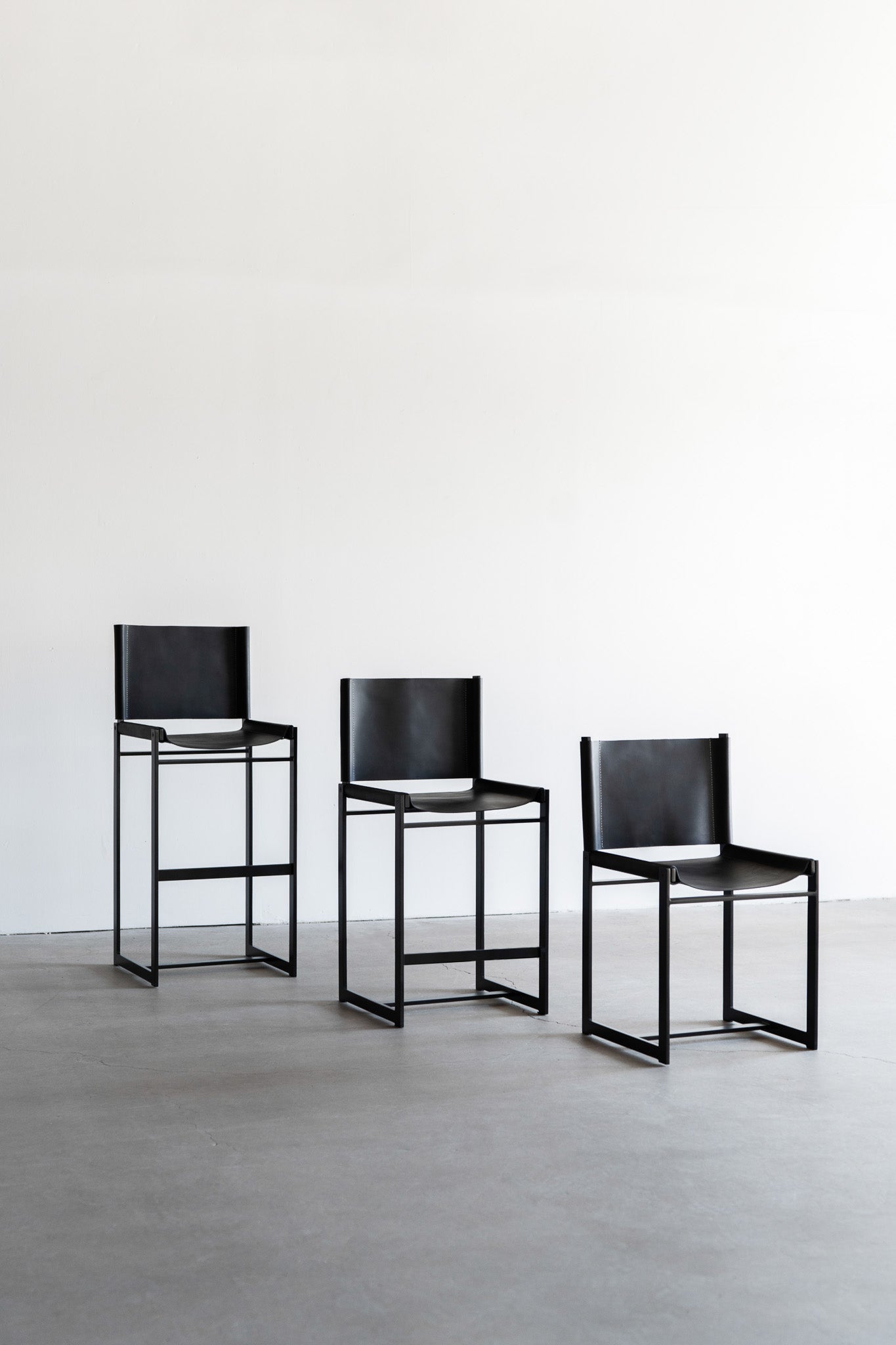 latigo bar stools - steel legs with black leather