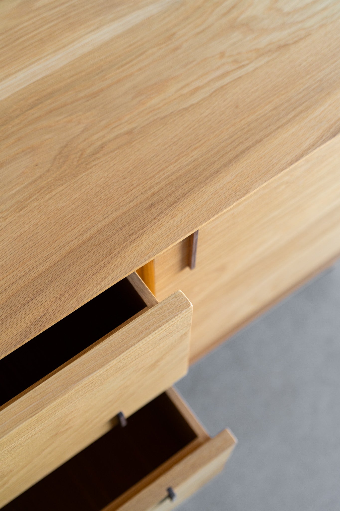 Nima sideboard - oak wood cabinet , close up on drawers 