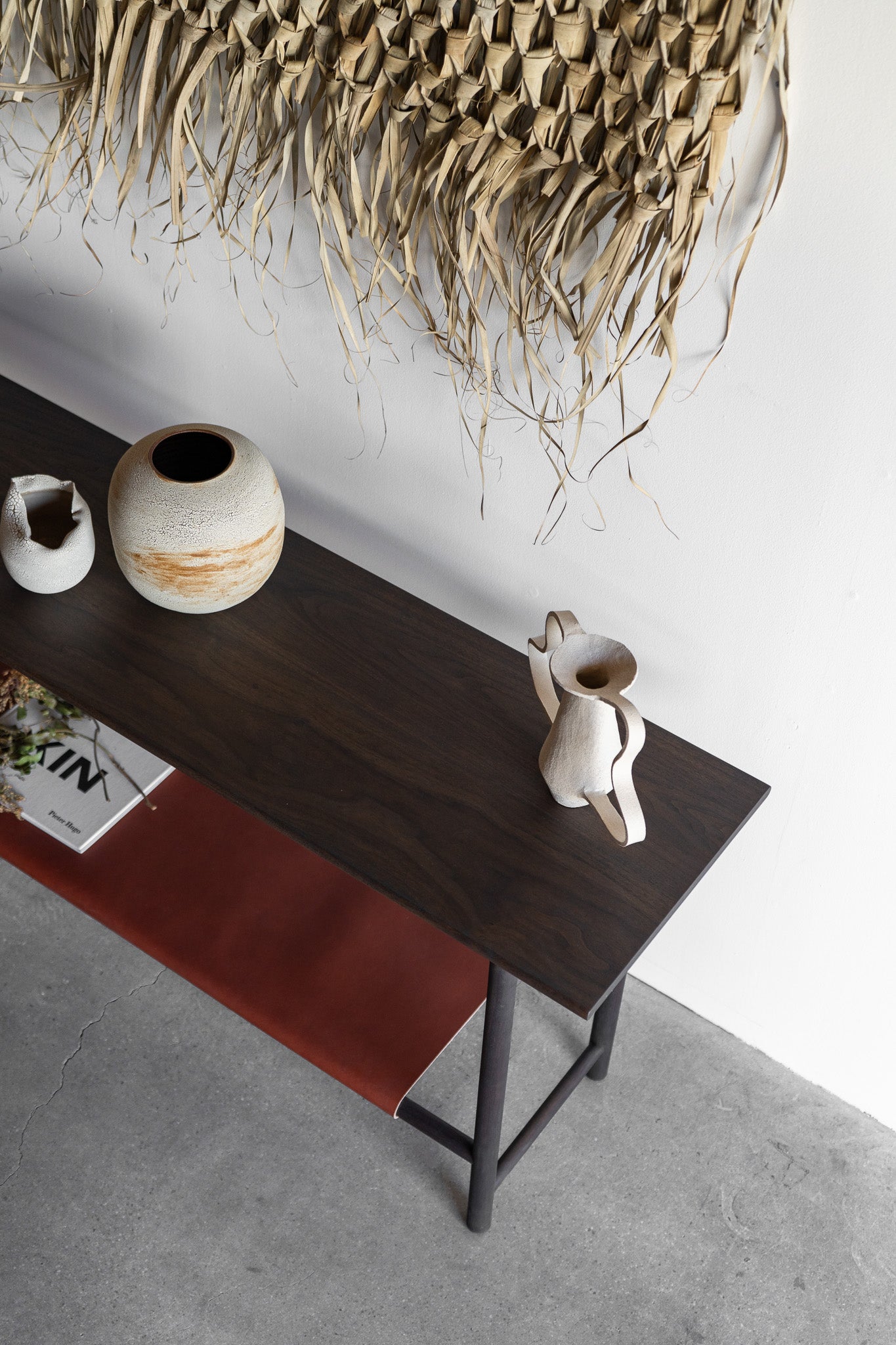 Reyes console- solid walnut, structural leather shelf