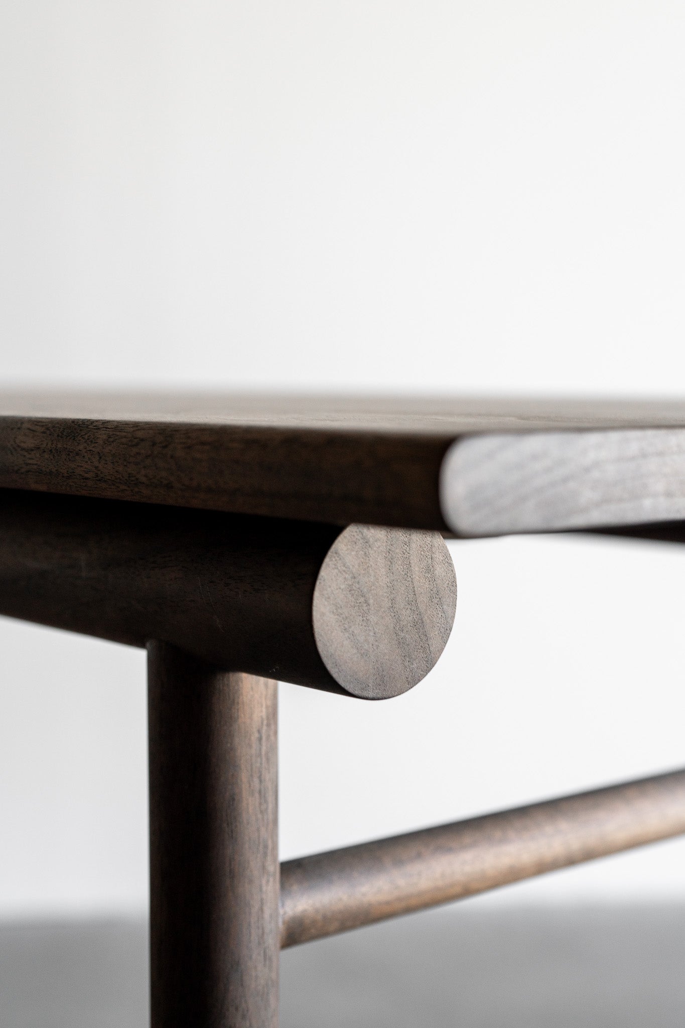 Reyes console- solid walnut, structural leather shelf