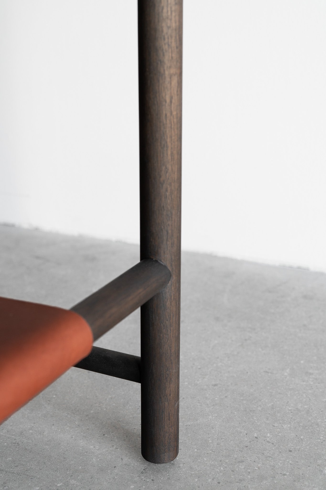 Reyes console- solid walnut, structural leather shelf