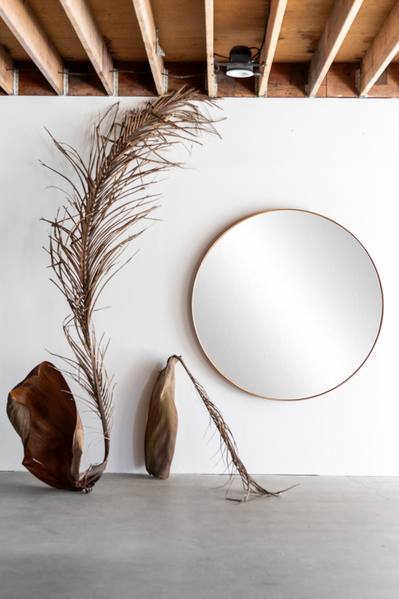 Reyes round mirror - wood mirror wrapped with tanned leather