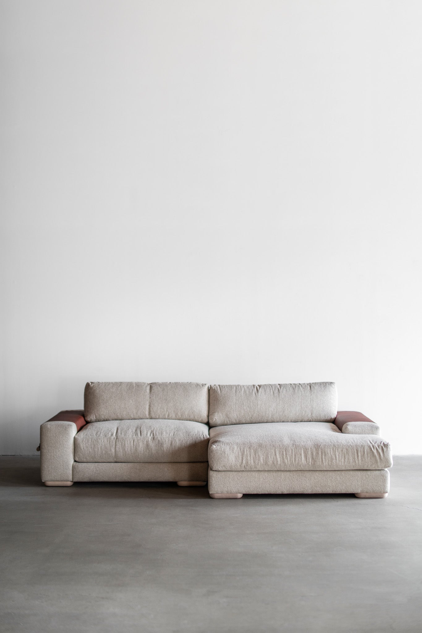 Full shot of Sofa with leather on arms