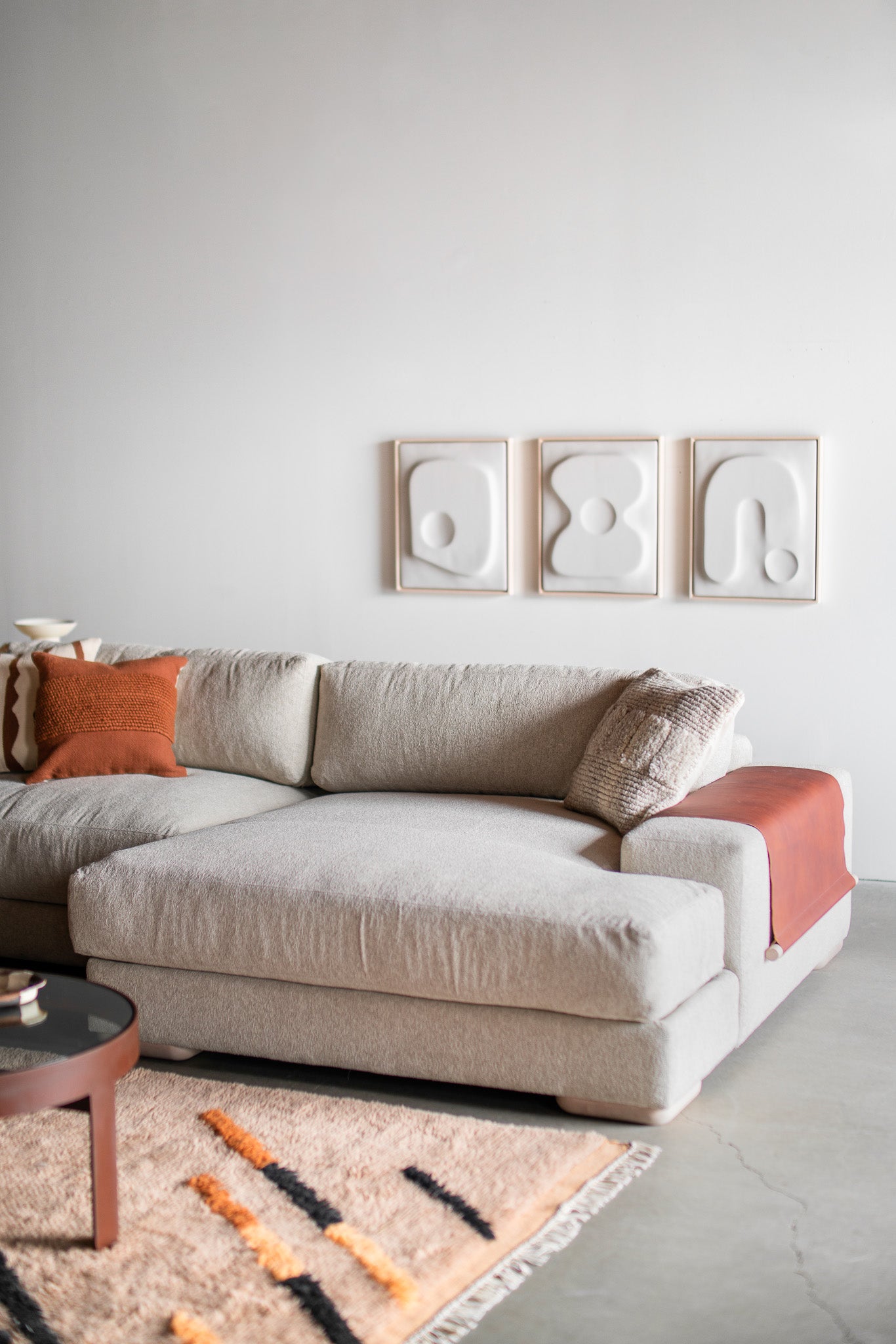 Side shot of Sofa with wood legs and leather arm