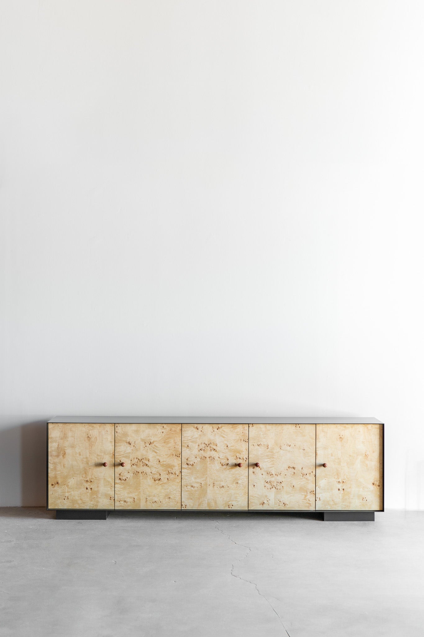 Solano credenza- Steel casing, burl doors with birch interiors