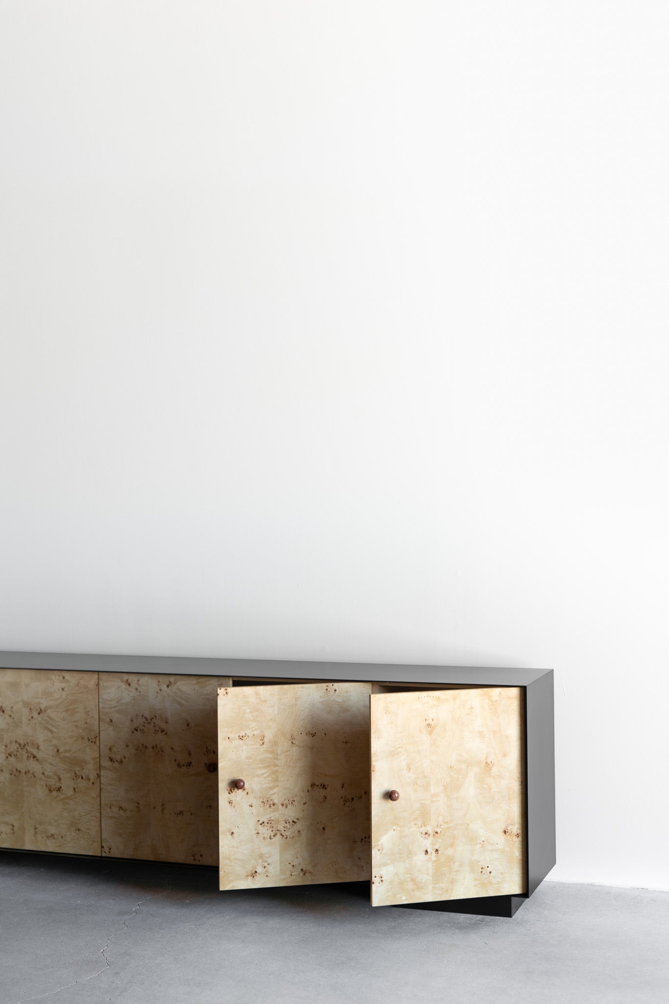 Solano credenza- Steel casing, burl doors with birch interiors