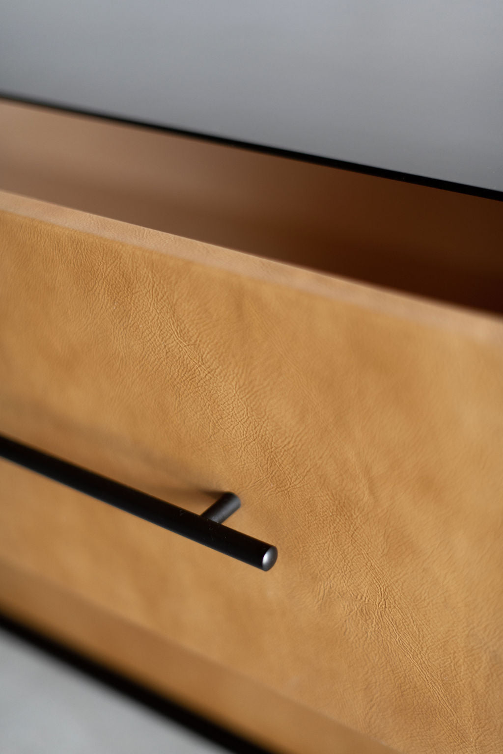 Zoomed in shot of drawer with leather faces 