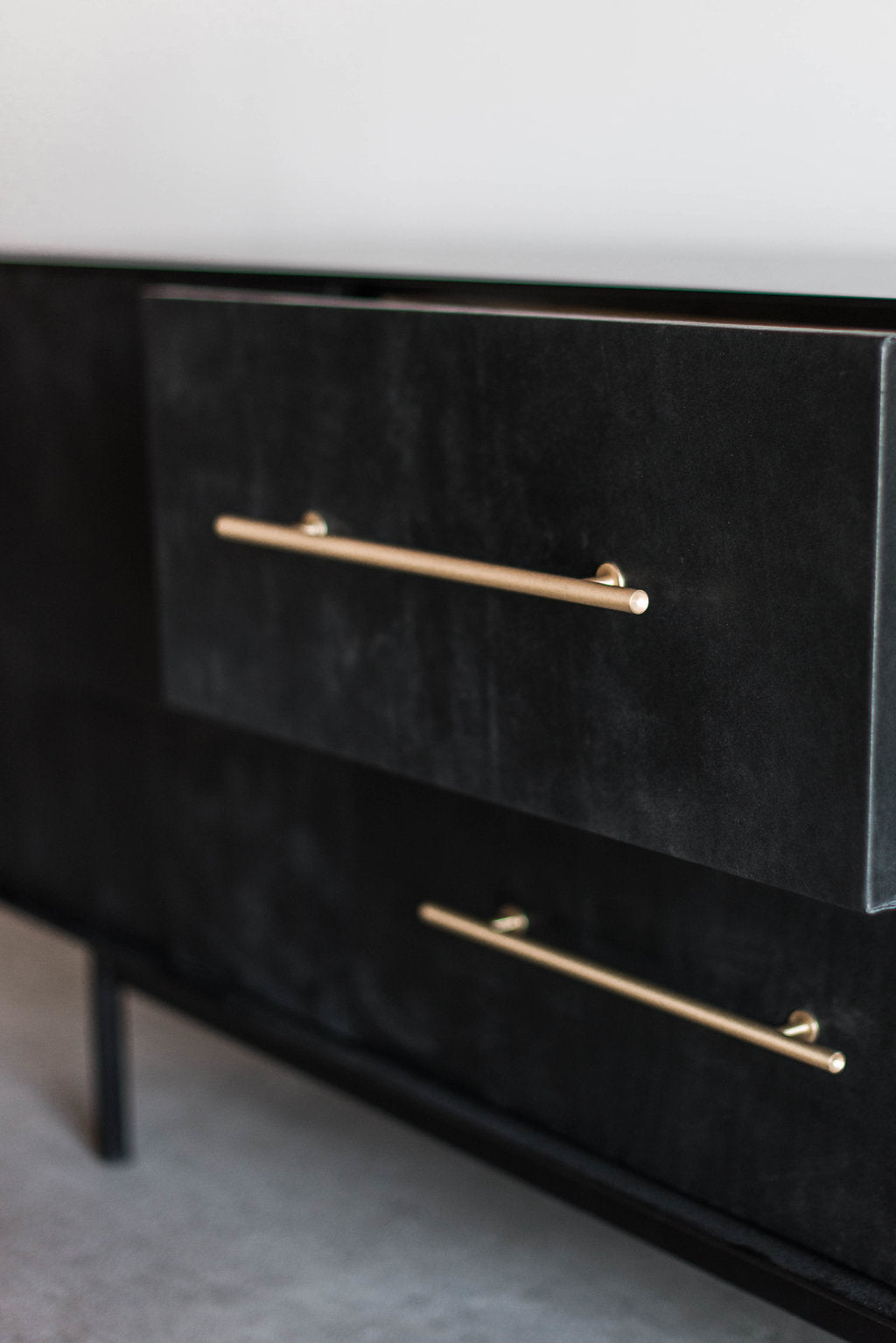 Close up of leather drawer with metal handle 