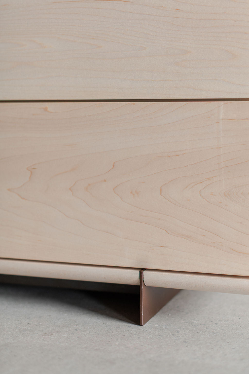 Carter dresser- bleached maple wood drawer and steel leg close up 