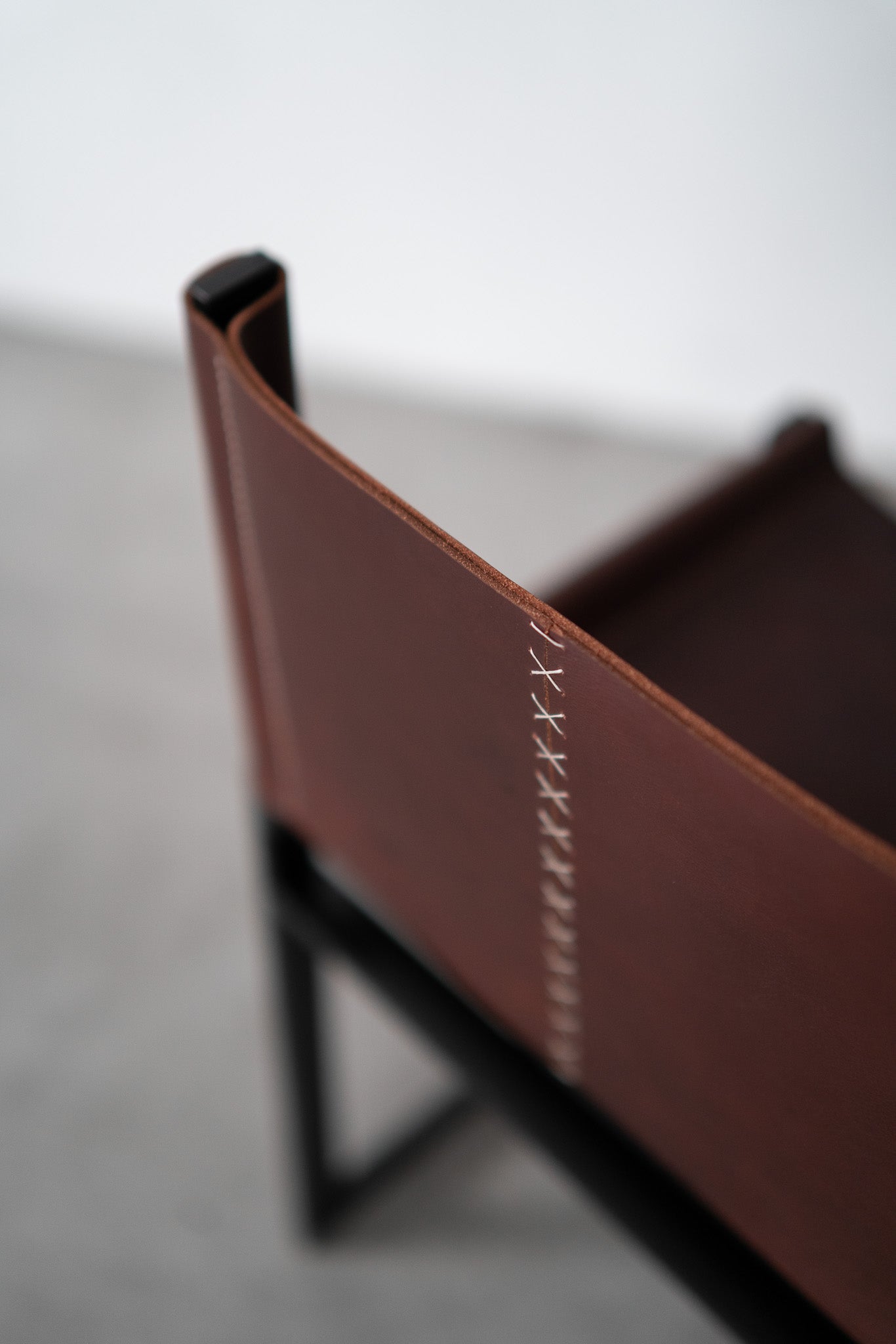 Latigo lounge chair- close up on leather seam 