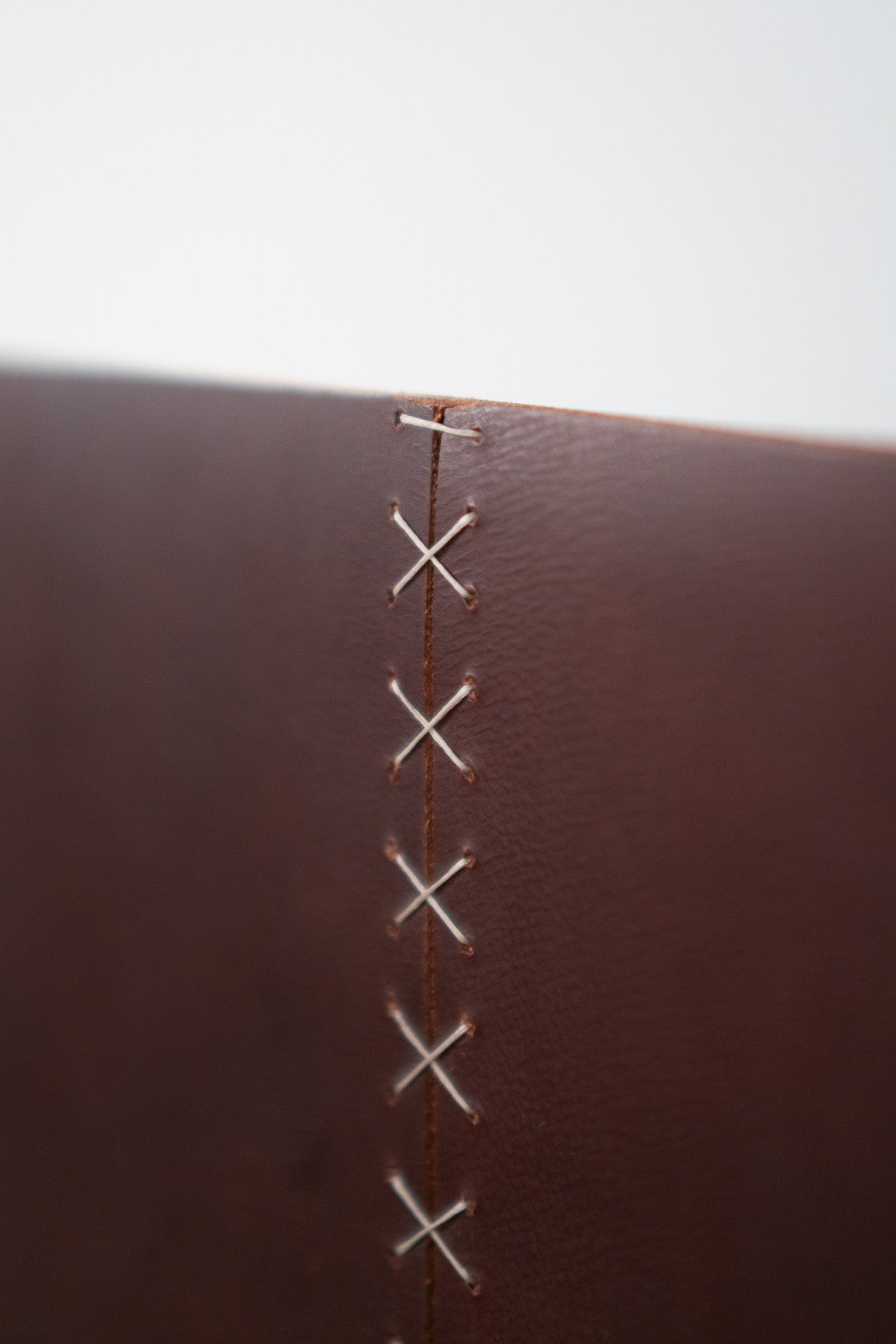 Latigo lounge chair - close up on leather seam 
