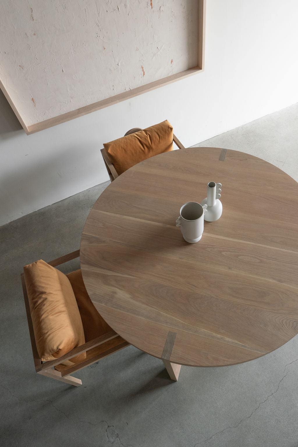 Eve dining table - top shop, table styled with two chairs 