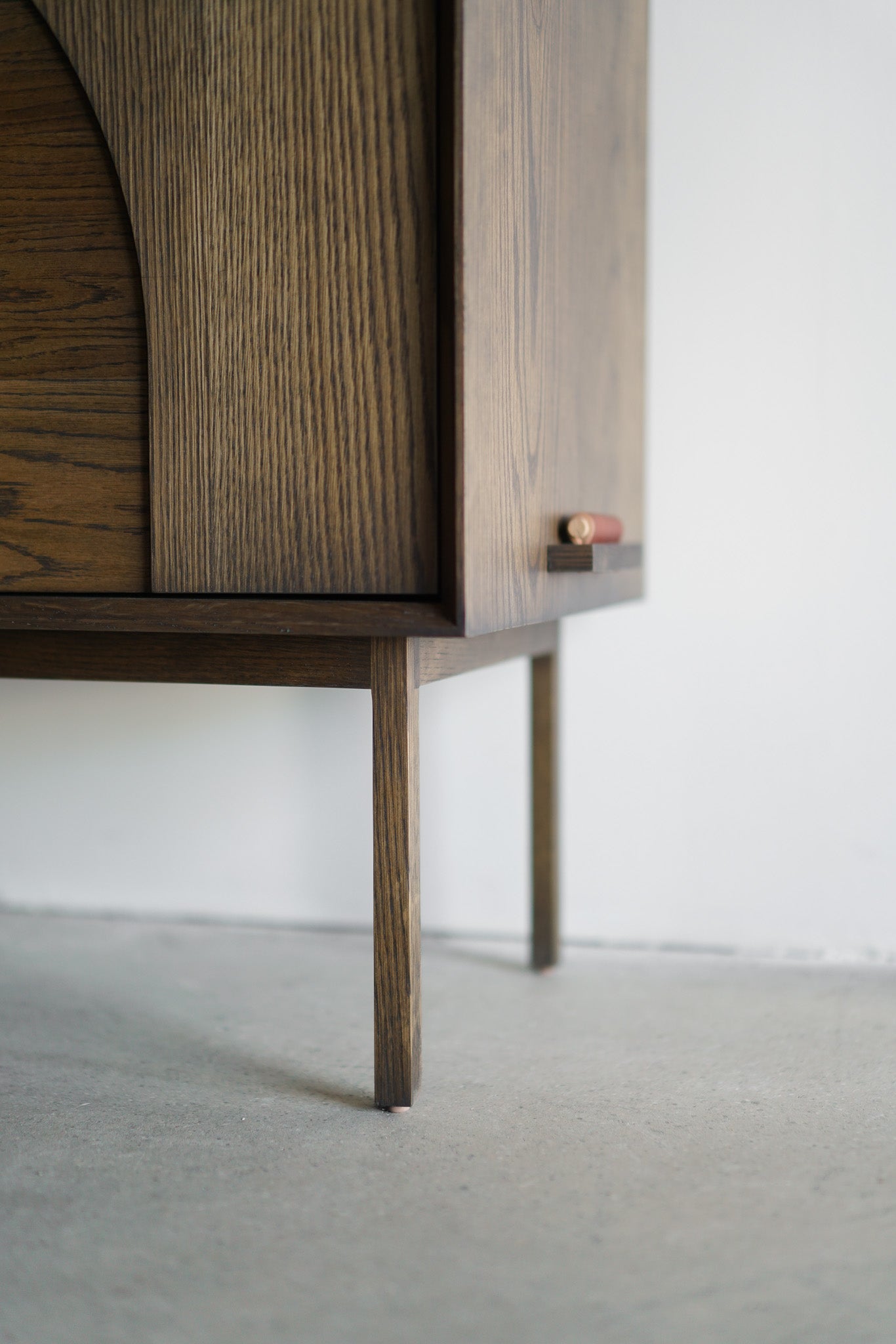 Flores credenza- bottom right close up on wooden legs 