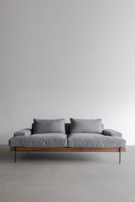 Rivera sofa- wood frame, steel legs and upholstered cushions 